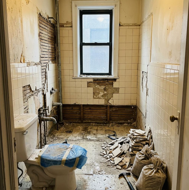 Demolition in progress in the Windsor Terrace condo bathroom