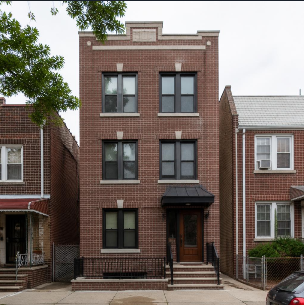 Finished Middle Village brick facade after scaffolding removal